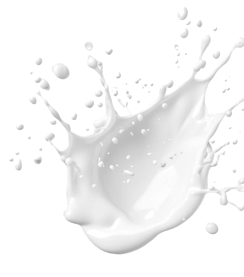 Salpicadura de un líquido blanco, probablemente de la máquina de ordeñar vegana, congelada en el aire sobre un fondo transparente.
