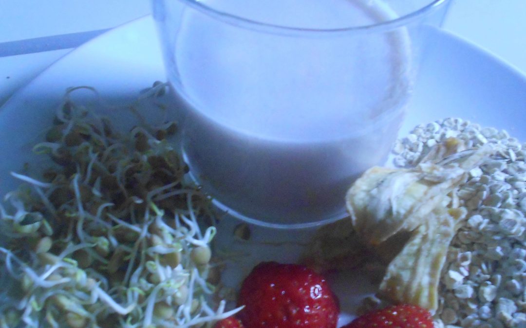 Oat milk with strawberries and lentil sprouts